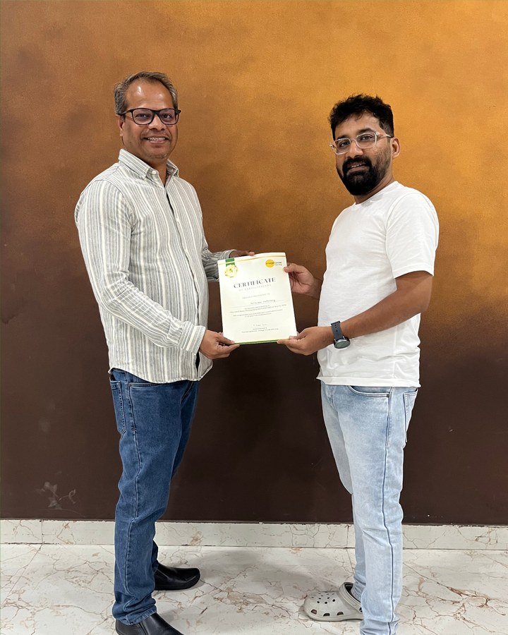 Participant receiving a certificate at the Hyderabad DSLR workshop
