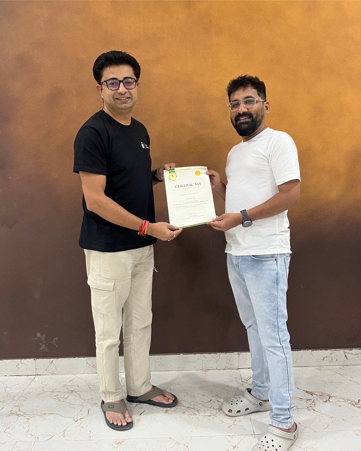 Participant receiving a certificate at the Hyderabad DSLR workshop